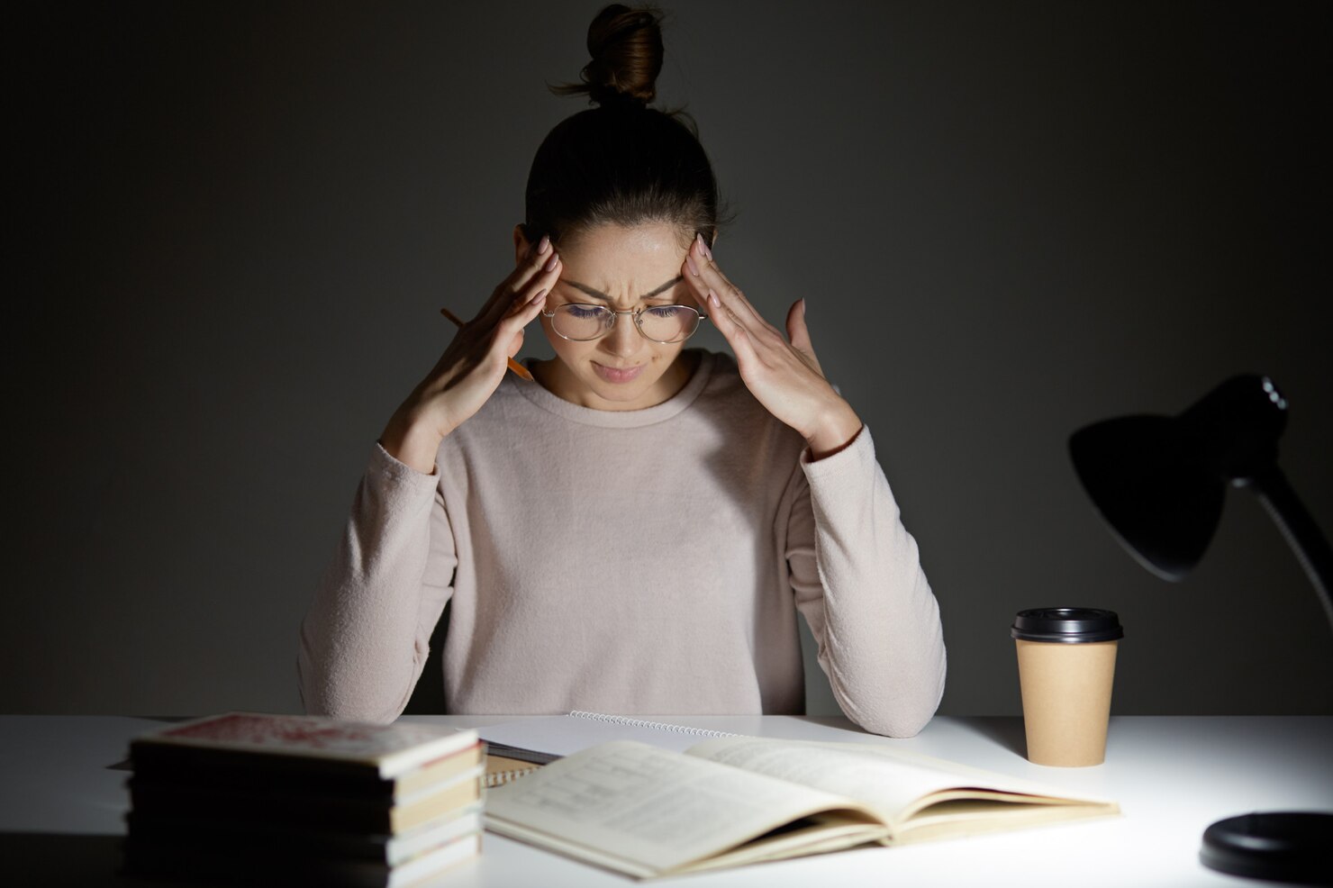 tired-stressful-woman-keeps-hands-head_176532-7089